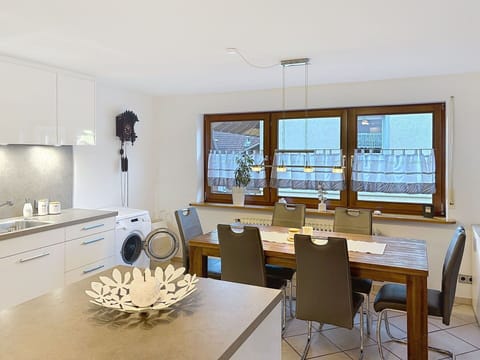 Furniture, Interior Design, Flooring, Light Fixture, Kitchen, Countertop, Wood, Ceiling, Floor, Chair