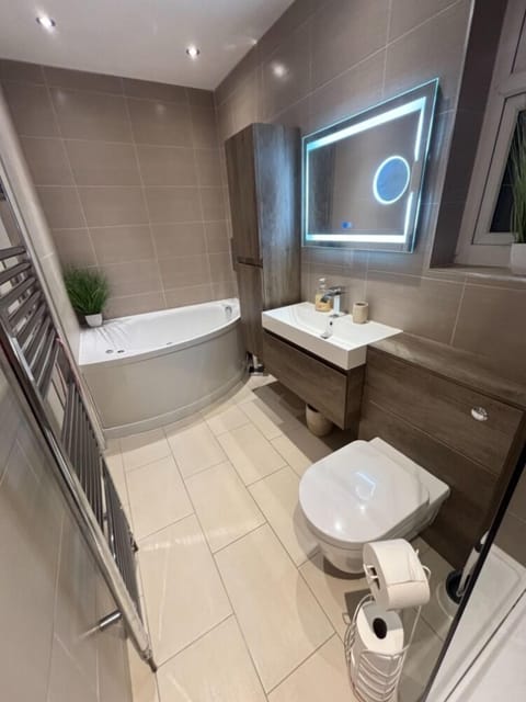 ensuite bathroom with rainfall walk-in shower