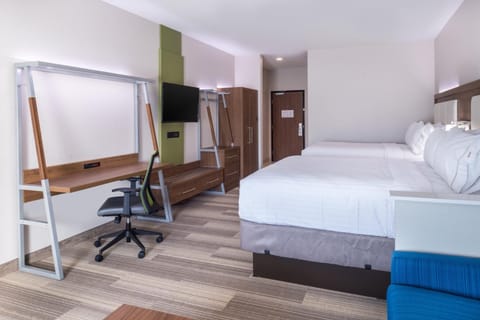 Settle into a spacious room with comfy beds and work desk.