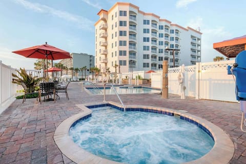 Soak in the bubbling hot tub with resort views nearby.