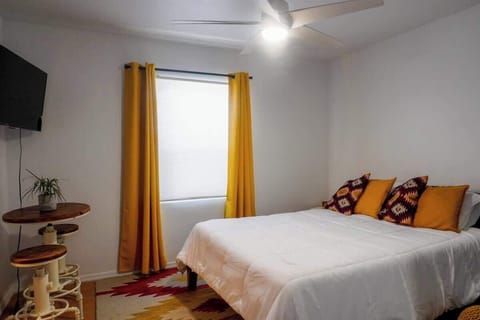 Cozy bedroom with a comfortable queen bed and fresh hotel-quality linens for a restful stay.