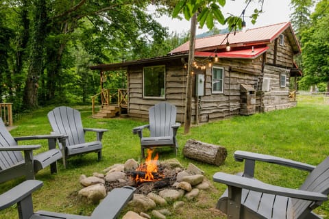 Cozy woodland cabin with fire pit seating and relaxing outdoor space