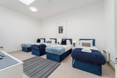 Our stunning top floor bedroom offers 4 single beds or can be arranged with prior notice into super kings if required. From soft bedding to supportive mattresses, our beds are prepared to give you the rest you deserve.