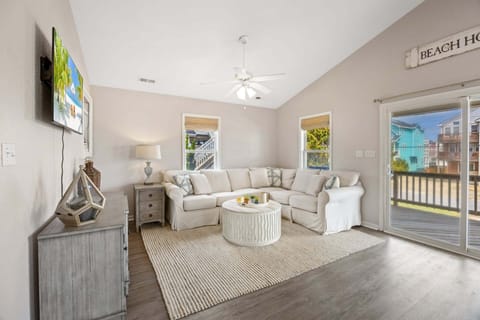 Bright and comfortable living space perfect for relaxing after a beach day.