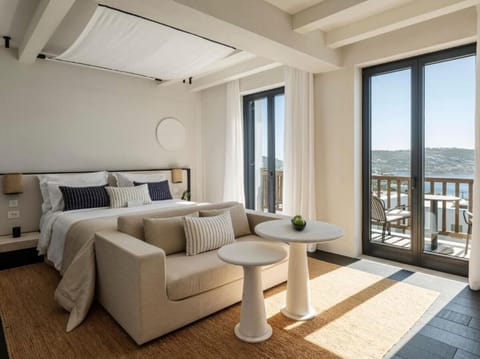 Wake up to sunlit luxury and sweeping balcony sea views.