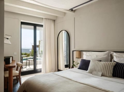Lounge in bed as ocean breezes drift through open doors.