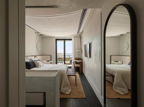 Unwind in a serene bedroom framed by soft island light.