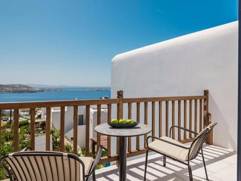 Sip morning coffee on your private balcony with sea views.