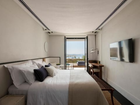 Stretch out in a serene bedroom framed by ocean views.