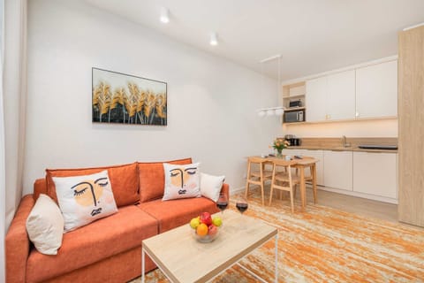 Living room with television and dining area.