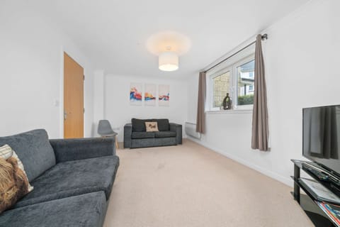Living Room: Bright and spacious retreat with stylish furniture and delightful views!