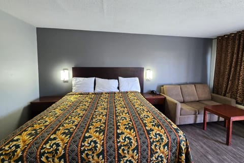 Stretch out on the king bed beside a comfy sofa.