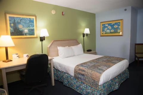 Recharge after meetings with a desk workspace and plush bed.