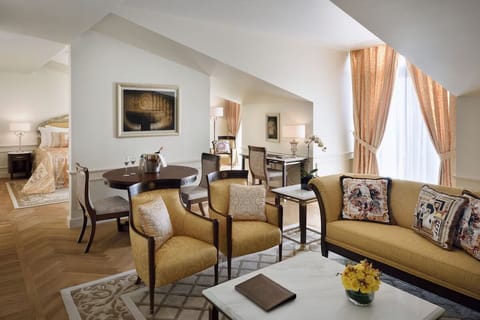 Unwind in elegant seating with sunlit windows and champagne vibes.