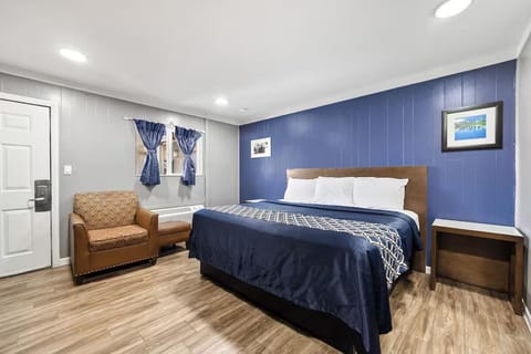 Unwind on plush bedding in a calm, modern room.