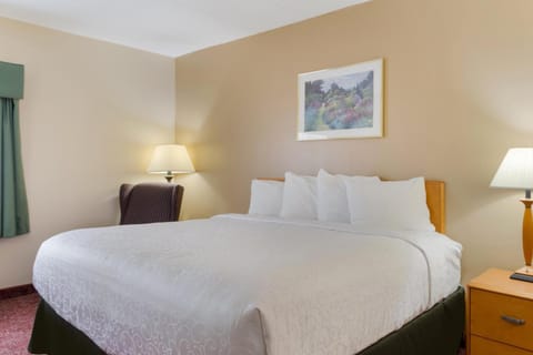Relax into a serene sleep space with soft bedside lighting.