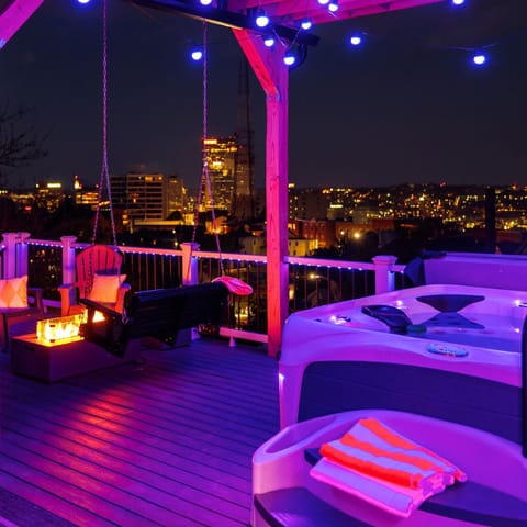 Feel the stress melt away as you soak in the hot tub, surrounded by twinkling city lights. Pure bliss awaits!