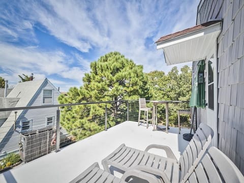 Enjoy a peaceful moment on the upper deck, featuring seating and a breezy atmosphere.