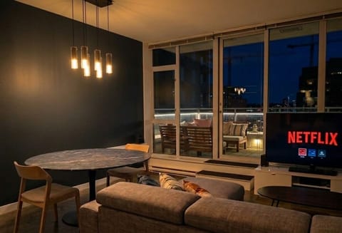 Modern finishes, and direct access to a large patio with stunning city views.