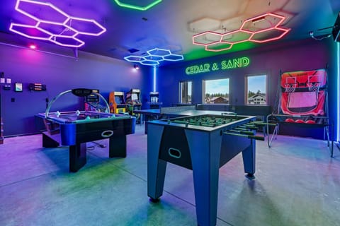 Cedar & Sand's game room — fully stacked for year-round fun whether its sunny, raining, or snowing! Foosball, air hockey, ping pong, pop-a-shot, LED-lit shuffleboard, 3x Arcade1UP arcade games featuring pacman, NFL Blitz, Fast & Furious & digital pinball!