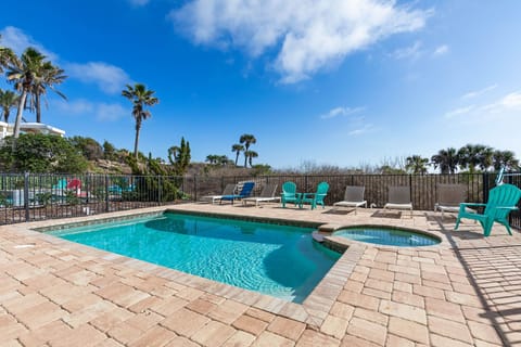 Sunlit afternoons slip by here with kids splashing in the pool, grandparents soaking in the spa, and everyone gathering poolside as palms sway overhead. By sunset, the day feels stitched together with laughter, warmth, and easy family joy.