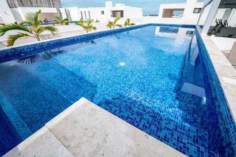 Dive into relaxation at our sparkling swimming pool