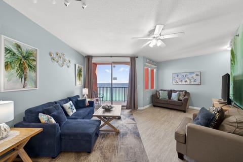 Relax in your bright coastal living room with ocean views and cozy seating for the whole family.