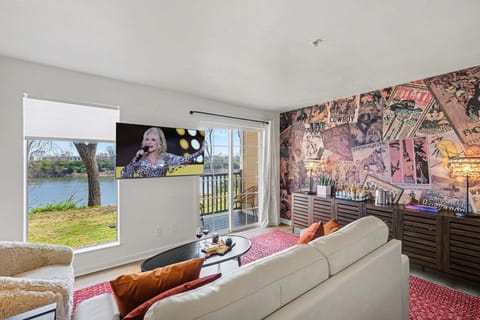 Open living area with Cozy furnishings, a smart TV, and access to the private patio overlooking the Cumberland River.