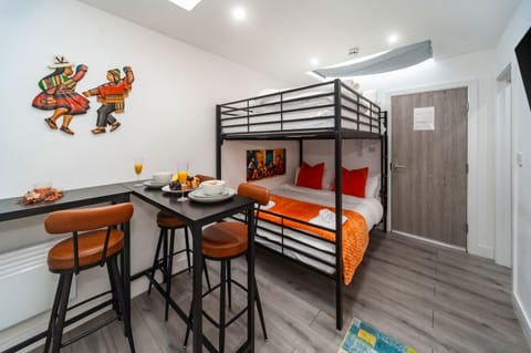 Comfortable sleeping setup for 4 people in this modern, budget-friendly studio.