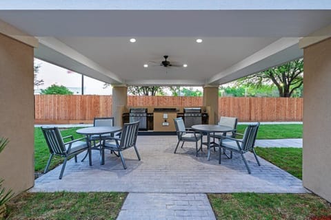 Gather around the outdoor grill area, perfect for cookouts with friends.