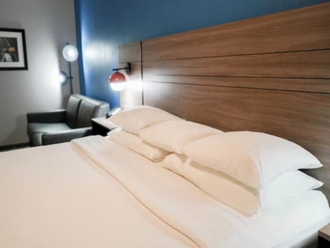 Drift off in silky sheets and soothing bedside ambiance.