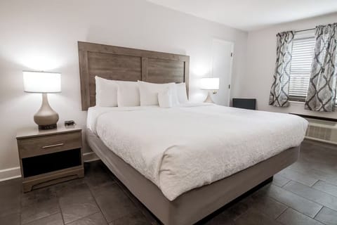 Stretch out in the spacious king bed beneath warm bedside lamps.