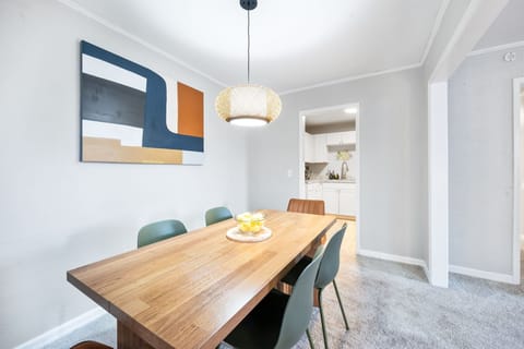 Bright modern dining room with stylish décor and easy kitchen access