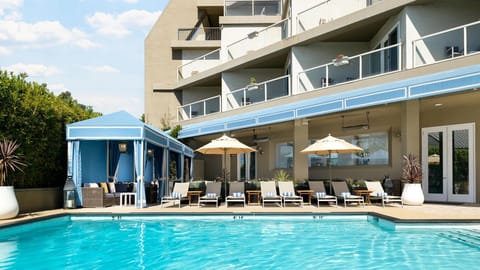 Soak up sunshine beside the sparkling pool and cabanas.