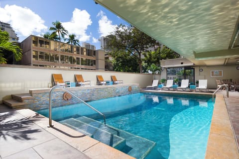 Dive into the sparkling pool and lounge under warm sun.