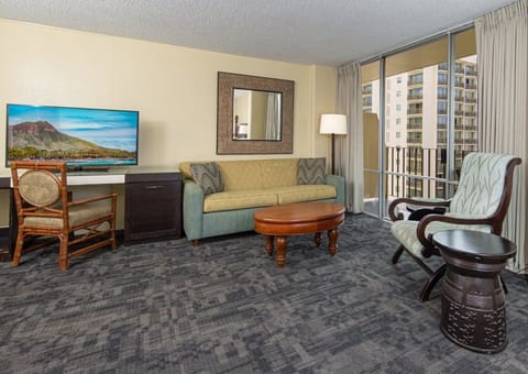Unwind on the sofa after beach days with calming views.