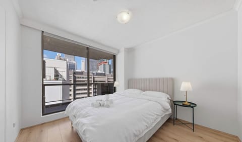 Spacious bedroom with large window views