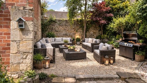 The pretty courtyard garden at Serenity is perfectly designed to offer a private space in which to entertain.