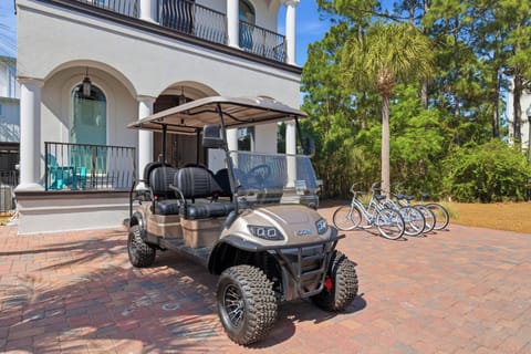 A golf cart and bicycles await your exploration adventures at this elegant vacation property.