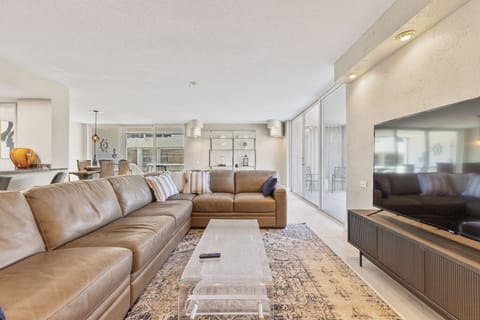 Settle into the living room with a 75" TV and queen pull-out sofa. Sleeps extra guests without sacrificing comfort.