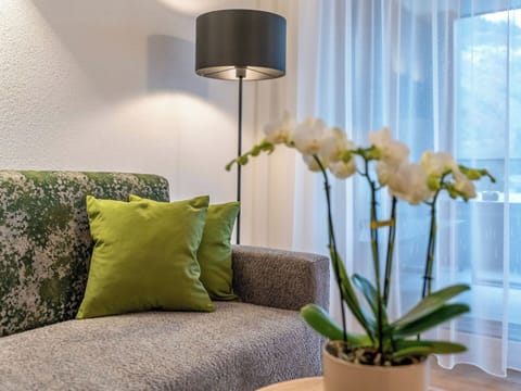 Furniture, Interior Design, Wall, Flooring, Couch, Home, Floor, Living Room, Room, Lighting