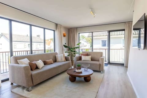 Modern living room with large windows and natural light