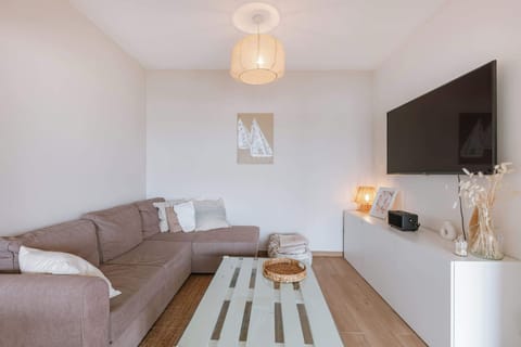 Cozy living room with a sectional sofa and wall-mounted television