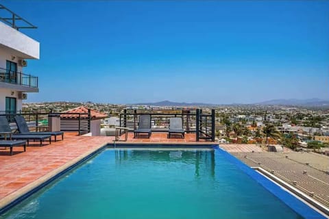 Shared pool w/ surrounding lounge space, perfect for soaking up the sun & cooling off