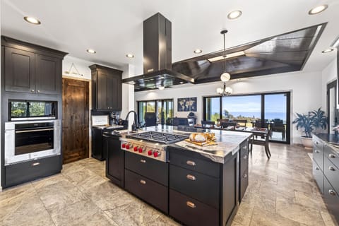 Chefs kitchen with ocean views - where mornings begin and evenings gather.