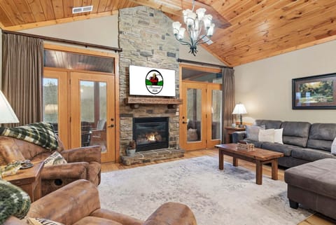 Living Area with Cable TV,Seasonal Fireplace, Screened Porch Access