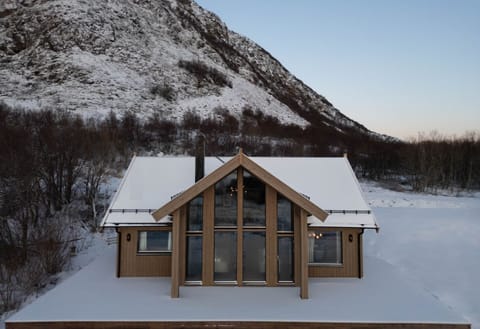 The cabin has large windows that let in lights on both floors!