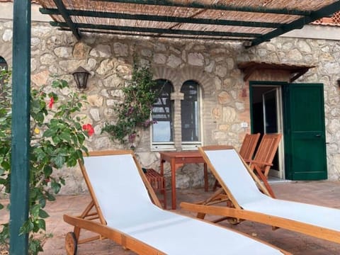 Casa Ibiscus Torre Bianca in Gaeta with a panoramic sea view and a terrace surrounded by greenery.