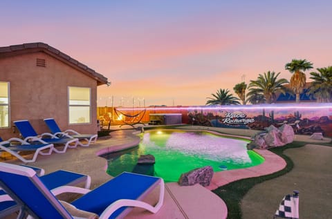 Backyard paradise at Race & Recharge—resort-style pool and sunset vibes for the ultimate escape.