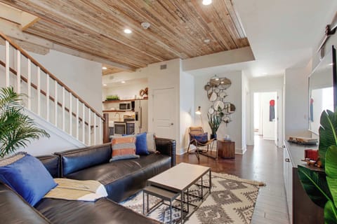 Living Room | Comfortable Seating Area with TV | First Floor of Third Floor Unit